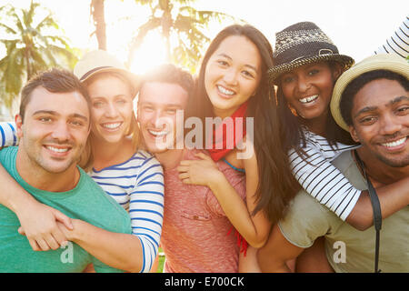 Group Of Friends Having Fun In Park Together Stock Photo