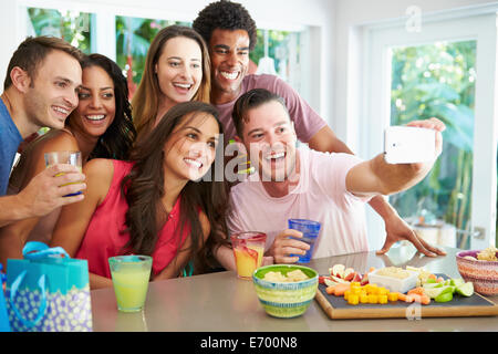 Group Of Friends Taking Selfie Whilst Celebrating Birthday Stock Photo