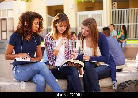 Three Female High School Students Working On Campus Stock Photo