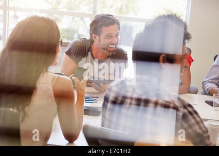 Designers Having Meeting Viewed Through Window Stock Photo