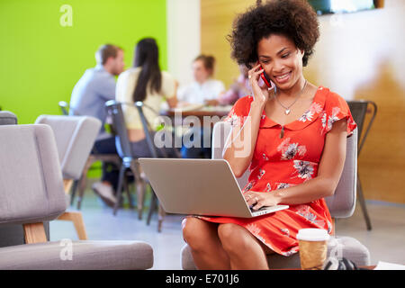 Woman Taking A Break Working In Design Studio Stock Photo