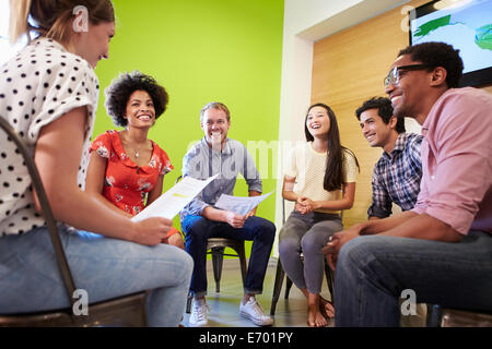 Group Of Designers Meeting To Discuss New Ideas Stock Photo