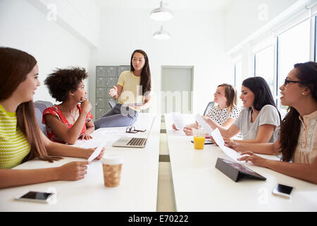 Group Of Women Working Together In Design Studio Stock Photo