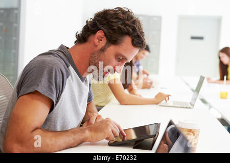 Design Team Collaborating On Project Together Stock Photo