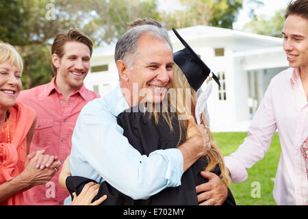 Female Student And Family Celebrating Graduation Stock Photo