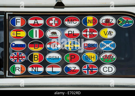 Country flag travel stickers on the window of a VW campervan. UK Stock Photo