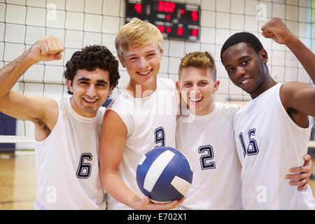 Members Of Male High School Volleyball Team Stock Photo