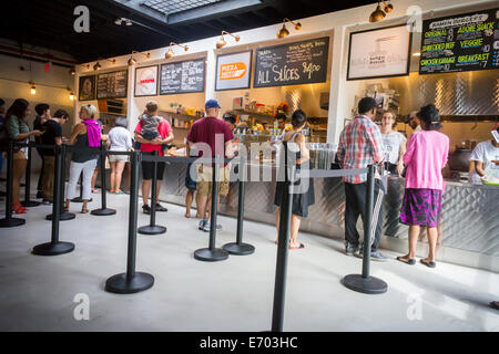 Customers on line at Berg'n a food and beer hall, in Crown Heights Brooklyn in New York Stock Photo