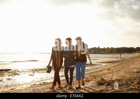 Female family members walking on beach Stock Photo