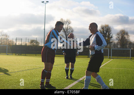 Football players starting game Stock Photo