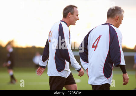 Football players at stop in game Stock Photo