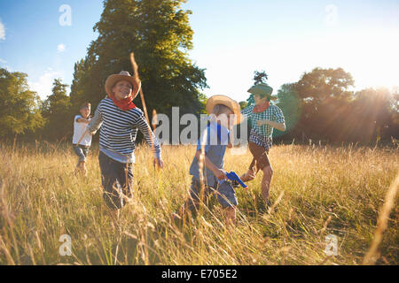 Group of young boys playing in field Stock Photo