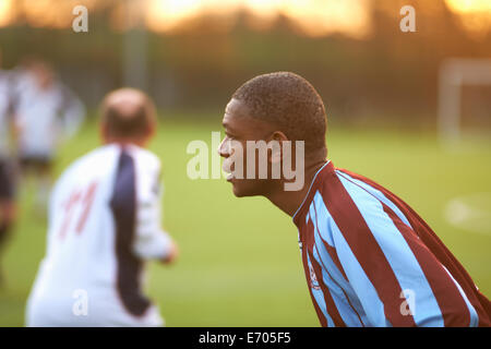 Football player alert at game Stock Photo