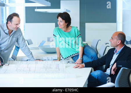 Three workers having business meeting Stock Photo