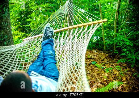 Teenage boy lying in hammock Stock Photo