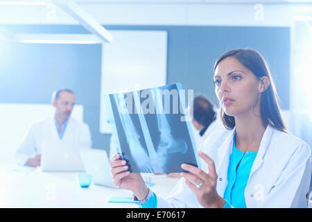 Female doctor looking at x-ray Stock Photo