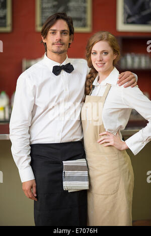 Portrait of waitress and waiter in restaurant Stock Photo