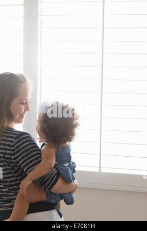 Mother holding baby daughter Stock Photo