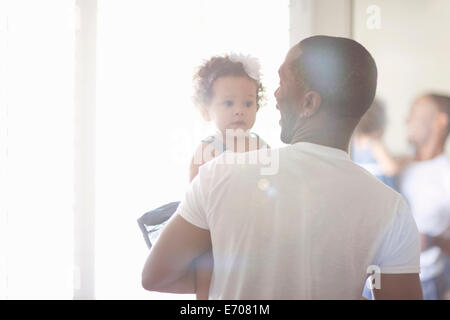 Father holding baby daughter Stock Photo