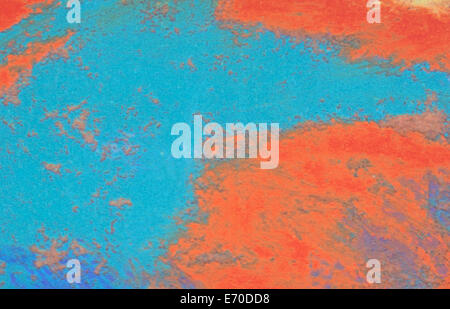 An old stucco wall that has been painted in bright orange yellows and blues. Stock Photo