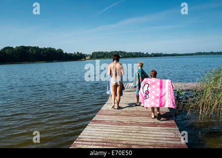 Family enjoying summer by the lake, Giby, Poland Stock Photo