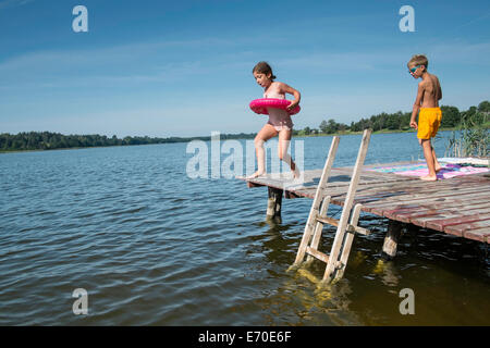 Family enjoying summer by the lake, Giby, Poland Stock Photo