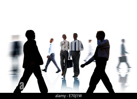 Business People Silhouettes Commuting and Isolated on White Stock Photo