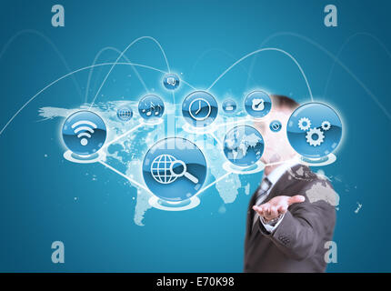 Businessman hold cloud of application icon and world map Stock Photo