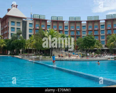 Tourists at the Hard Rock Hotel at Sentosa island in Singapore Stock Photo