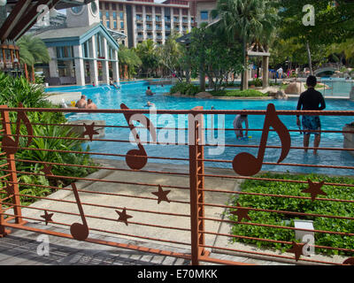 Tourists at the Hard Rock Hotel at Sentosa island in Singapore Stock Photo