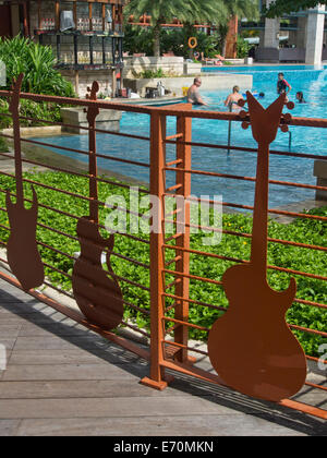 Tourists at the Hard Rock Hotel at Sentosa island in Singapore Stock Photo