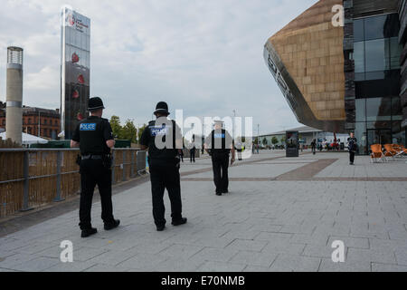 Cardiff, UK. 2nd Sep, 2014. Police officers walking around Wales Millennium Centre before the NATO Summit on 4th and 5th September.  The police force are part of a massive security operation for the NATO Summit at the Celtic Manor, Newport. This is the first NATO Summit in the United Kingdom since 1990. Leaders from about 60 countries worldwide are expected to attend. Credit:  Owain Thomas/Alamy Live News Stock Photo