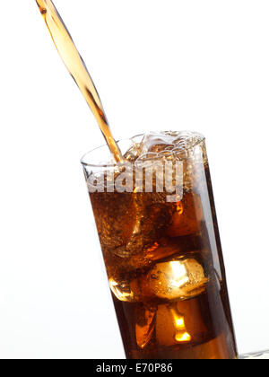 Cola being pored into glass, bubbles, ice cubes Stock Photo - Alamy