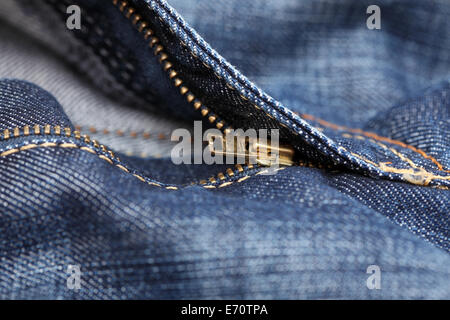 Zipper on blue jeans. Closeup. Stock Photo