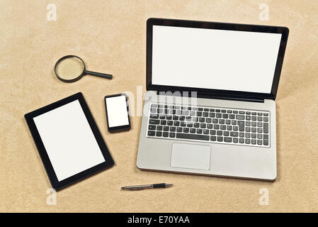 Responsive Web Design conceptual backdrop including digital tablet, mobile smartphone and laptop computer with blank white scree Stock Photo