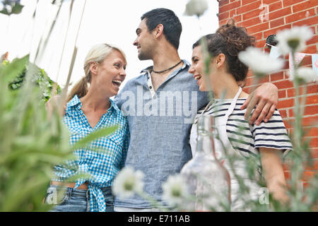Three friends at garden party Stock Photo