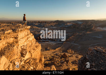 Man on cliff, Valle de la Luna (Valley of the Moon), Atacama Desert, El Norte Grande, Chile Stock Photo