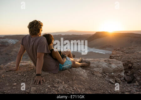 Couple on cliff, Valle de la Luna (Valley of the Moon), Atacama Desert, El Norte Grande, Chile Stock Photo