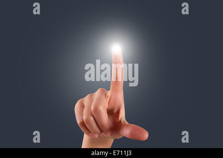 Young female hand finger touching or pressing digital screen on air. Stock Photo