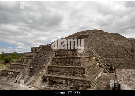 tourists climbing on the stairs of the pyramid of the Moon in the ancient city of Teotihuacan