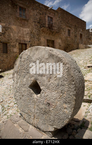 Stone wheel detail in front of a stone house in Real de Catorce, Mexico Stock Photo