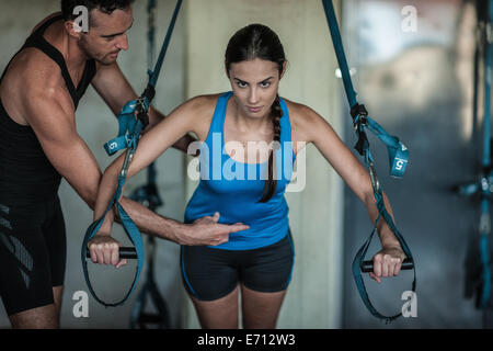 Young woman weight training Stock Photo