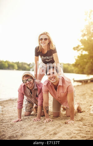 Three friends on beach, portrait Stock Photo