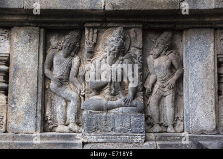Yogyakarta, Java, Indonesia.  Prambanan Temples.  Servant and Guard of Shiva, Wall Relief Carving. Stock Photo