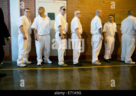 Male inmates line-up in hallways of Darrington Correctional Institute. The prison is near Houston, Texas Stock Photo