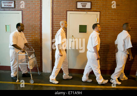 Male inmates line-up in hallways of Darrington Correctional Institute. The prison is near Houston, Texas Stock Photo