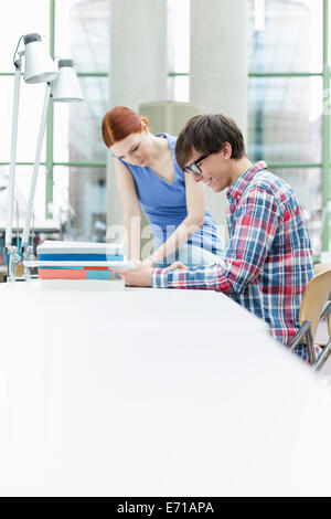 Two students learning in a university library Stock Photo - Alamy