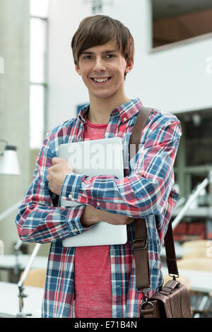 Portrait of student learning in a university library Stock Photo - Alamy