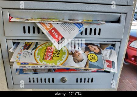 Gdansk, Poland 3rd, September 2014 Flyers , junk mail in the mailbox on the block of flats wall Stock Photo