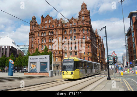 Metrolink tram with Midland hotel in the background in central Manchester. Stock Photo